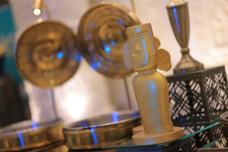 Brass sculptural accents and discs on a styled table